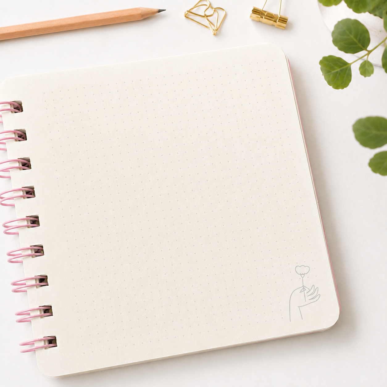 Libreta Flor en mano